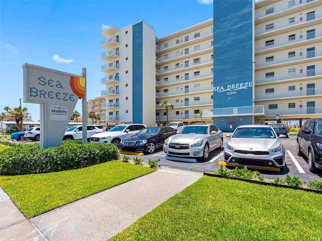 13500 Gulf Blvd Unit 506, Madeira Beach, FL 33708 - view of apartment building / complex featuring uncovered parking
