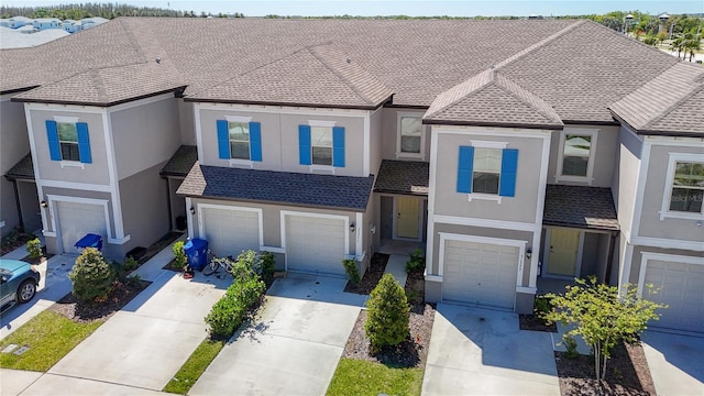 31771 Blue Passing Loop, Wesley Chapel, FL 33545 - view of front of home with a garage, driveway, and stucco siding