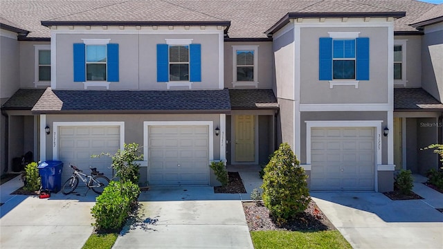 31771 Blue Passing Loop, Wesley Chapel, FL 33545 - view of property with driveway, a garage, and roof with shingles