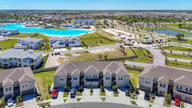 31771 Blue Passing Loop, Wesley Chapel, FL 33545 - aerial view of residential area with a nearby body of water and a pool area