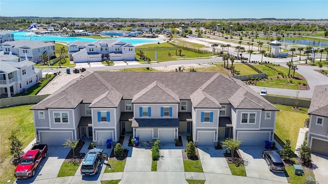 31771 Blue Passing Loop, Wesley Chapel, FL 33545 - aerial view of residential area featuring a pool area and a large body of water