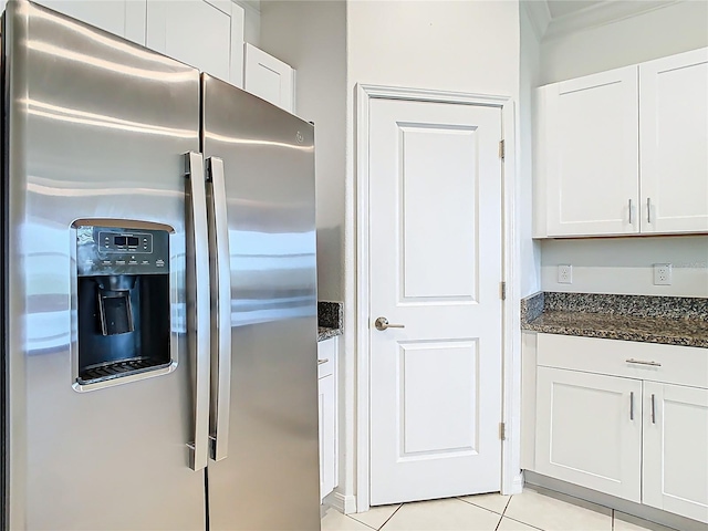 31771 Blue Passing Loop, Wesley Chapel, FL 33545 - kitchen featuring stainless steel fridge with ice dispenser, dark stone counters, white cabinets, and light tile patterned flooring