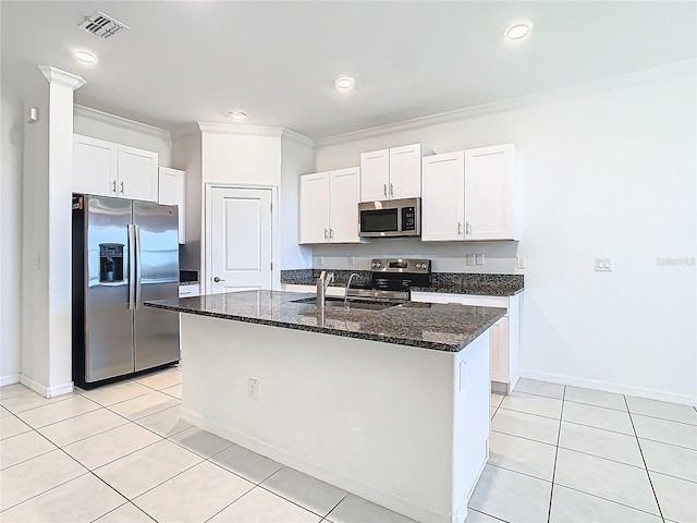31771 Blue Passing Loop, Wesley Chapel, FL 33545 - kitchen with stainless steel appliances, a sink, dark stone counters, white cabinets, and recessed lighting