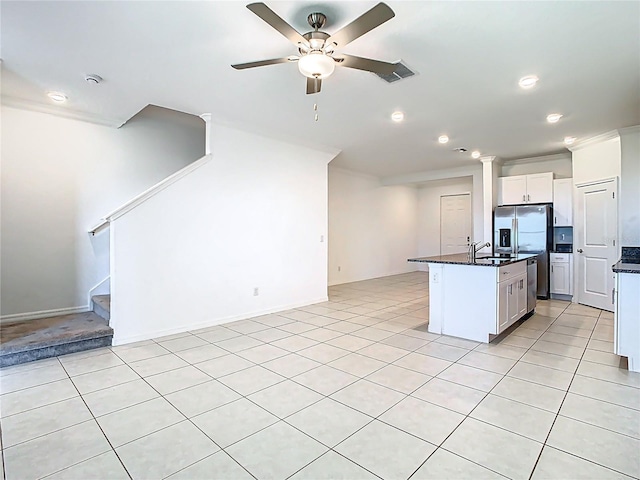 31771 Blue Passing Loop, Wesley Chapel, FL 33545 - kitchen with recessed lighting, an island with sink, white cabinetry, light tile patterned floors, and a sink