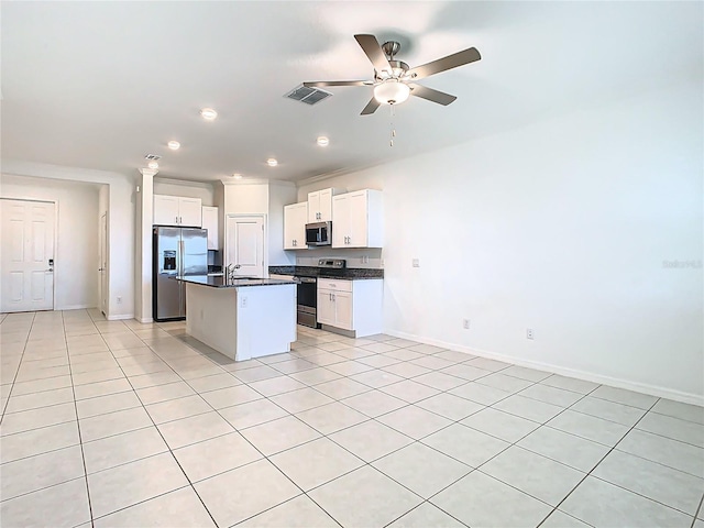 31771 Blue Passing Loop, Wesley Chapel, FL 33545 - kitchen featuring stainless steel appliances, dark countertops, open floor plan, baseboards, and recessed lighting