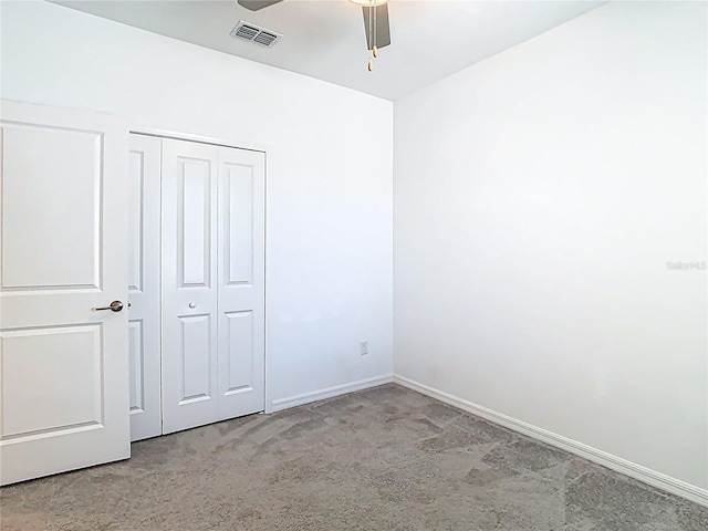 31771 Blue Passing Loop, Wesley Chapel, FL 33545 - unfurnished bedroom featuring a closet, baseboards, carpet, and ceiling fan