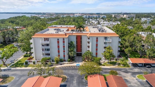 2630 Pearce Dr Unit 108, Clearwater, FL 33764 - view of property with uncovered parking and a water view