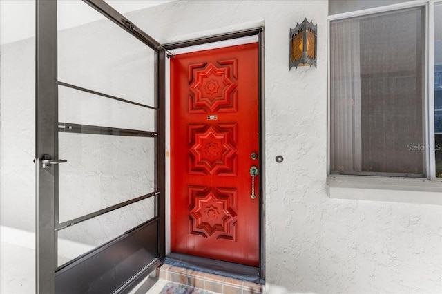 2630 Pearce Dr Unit 108, Clearwater, FL 33764 - view of exterior entry featuring stucco siding