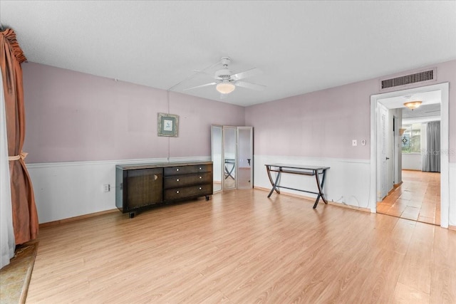 2630 Pearce Dr Unit 108, Clearwater, FL 33764 - unfurnished bedroom featuring wood finished floors, ceiling fan, and baseboards