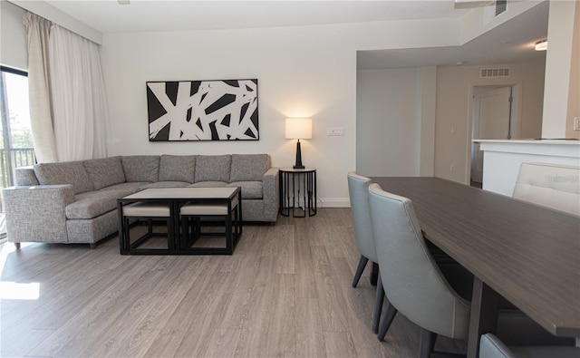 14501 Grove Resort Ave Unit 3316, Winter Garden, FL 34787 - living room with light wood-type flooring and baseboards