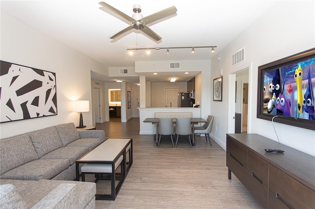 14501 Grove Resort Ave Unit 3316, Winter Garden, FL 34787 - living area featuring track lighting, light wood finished floors, and a ceiling fan