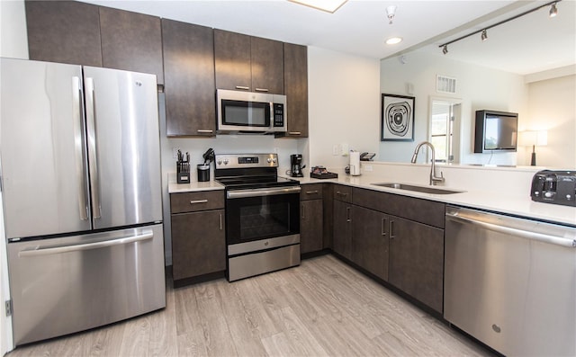 14501 Grove Resort Ave Unit 3316, Winter Garden, FL 34787 - kitchen with stainless steel appliances, a sink, light countertops, and recessed lighting