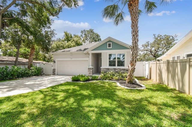 527 Bay St, Dunedin, FL 34698 - view of front of house with stone siding, a garage, stucco siding, and driveway