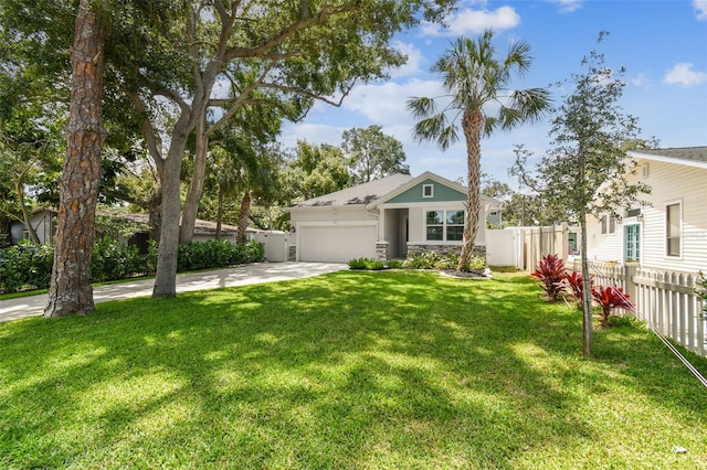 527 Bay St, Dunedin, FL 34698 - view of front of property featuring an attached garage, driveway, and stone siding