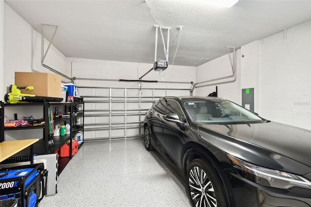 527 Bay St, Dunedin, FL 34698 - garage with electric panel and a garage door opener