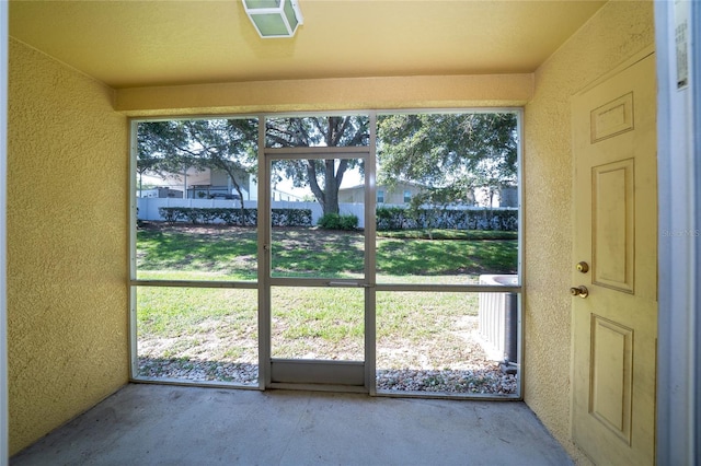37712 Aaralyn Rd, Zephyrhills, FL 33542 - detailed view of a textured wall and unfinished concrete floors