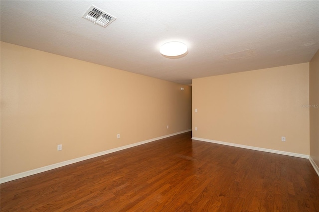 37712 Aaralyn Rd, Zephyrhills, FL 33542 - empty room with wood finished floors and baseboards
