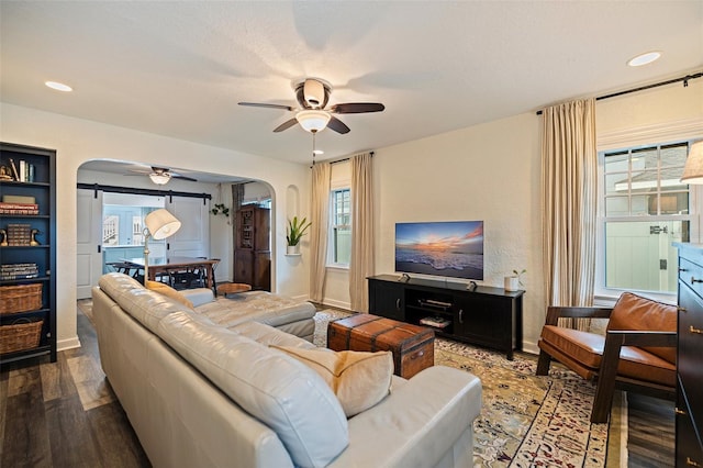 2519 1st Ave N, Saint Petersburg, FL 33713 - living room with arched walkways, a ceiling fan, wood finished floors, and recessed lighting