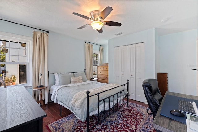2519 1st Ave N, Saint Petersburg, FL 33713 - bedroom featuring dark wood-style floors, a closet, an office area, and a ceiling fan