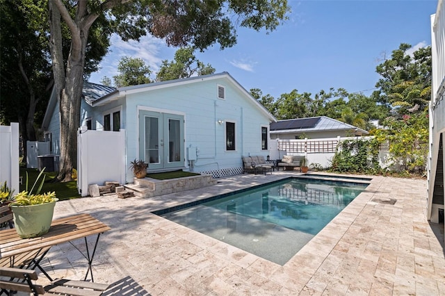 2519 1st Ave N, Saint Petersburg, FL 33713 - rear view of property with french doors, a patio, and a fenced backyard
