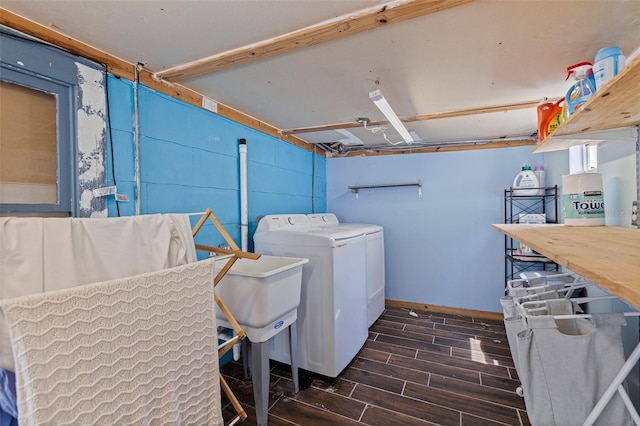 2519 1st Ave N, Saint Petersburg, FL 33713 - washroom featuring separate washer and dryer, dark wood finished floors, and baseboards