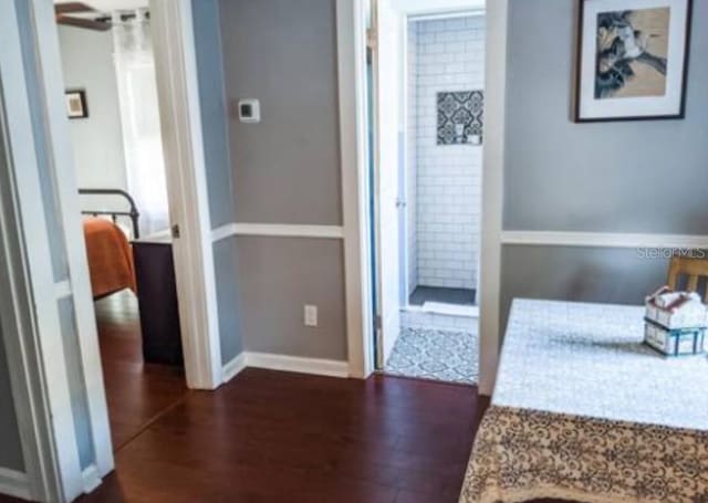 2519 1st Ave N, Saint Petersburg, FL 33713 - hallway featuring dark wood-type flooring and baseboards