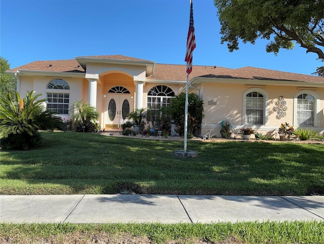 13339 Amberwood St, Hudson, FL 34669 - single story home featuring a front lawn and stucco siding