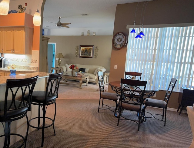 13339 Amberwood St, Hudson, FL 34669 - dining area featuring ceiling fan and carpet flooring