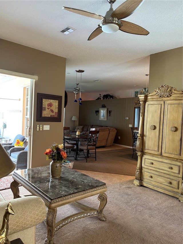 13339 Amberwood St, Hudson, FL 34669 - living area with light colored carpet and a ceiling fan