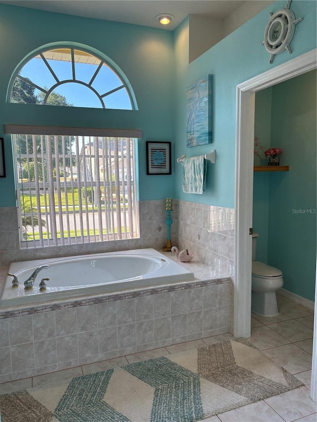 13339 Amberwood St, Hudson, FL 34669 - bathroom with a bath, tile patterned floors, and toilet