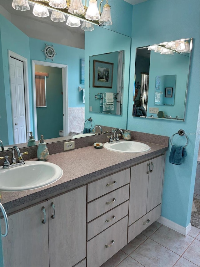13339 Amberwood St, Hudson, FL 34669 - full bath featuring double vanity, toilet, and tile patterned floors