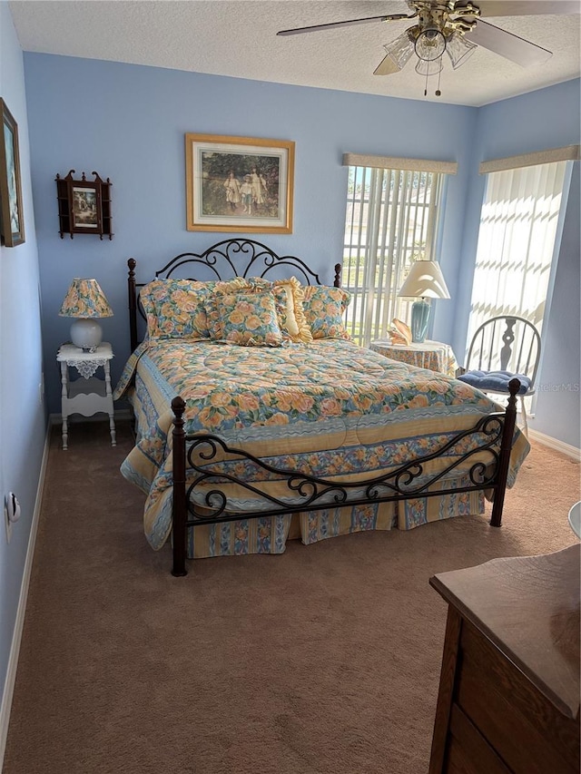 13339 Amberwood St, Hudson, FL 34669 - bedroom featuring carpet floors, baseboards, a textured ceiling, and ceiling fan