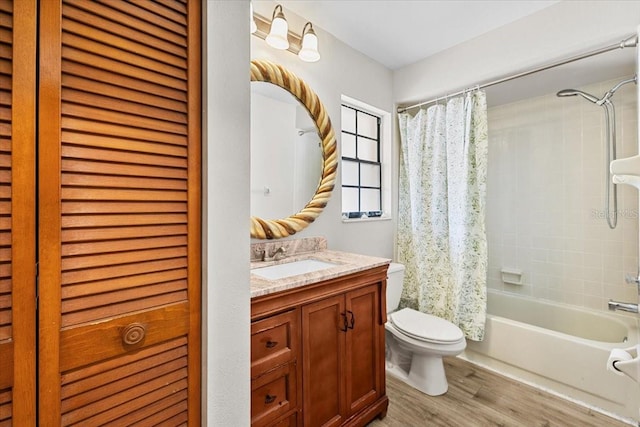 7633 Piping Rock Ct Unit 7633, New Port Richey, FL 34654 - bathroom featuring toilet, wood finished floors, shower / bath combo, and vanity