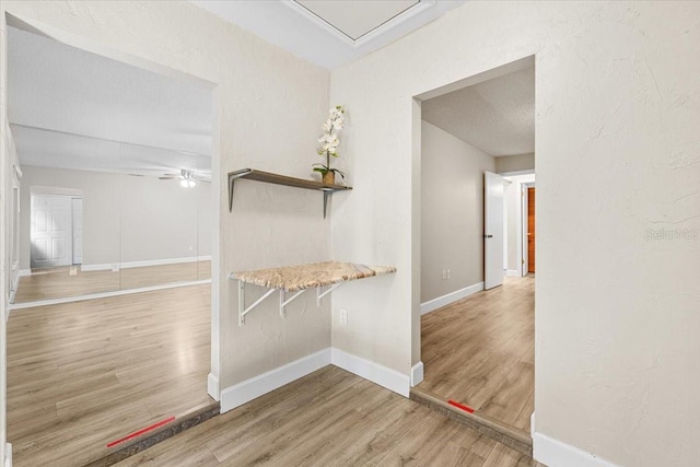 7633 Piping Rock Ct Unit 7633, New Port Richey, FL 34654 - corridor with wood finished floors and baseboards