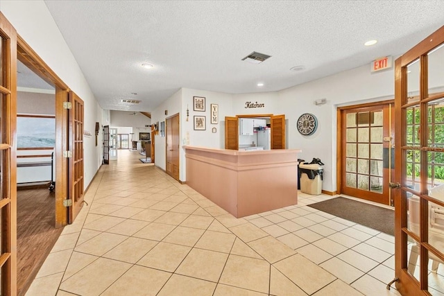 7633 Piping Rock Ct Unit 7633, New Port Richey, FL 34654 - reception featuring french doors, a textured ceiling, and recessed lighting