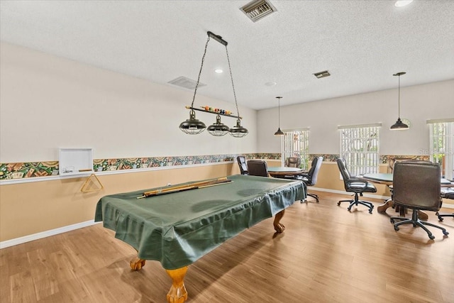 7633 Piping Rock Ct Unit 7633, New Port Richey, FL 34654 - recreation room featuring billiards table, wood finished floors, a textured ceiling, recessed lighting, and a wainscoted wall