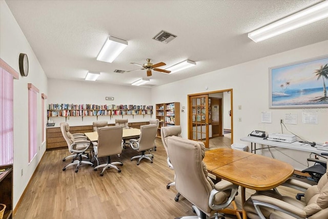 7633 Piping Rock Ct Unit 7633, New Port Richey, FL 34654 - office area with light wood-type flooring, a textured ceiling, and a ceiling fan