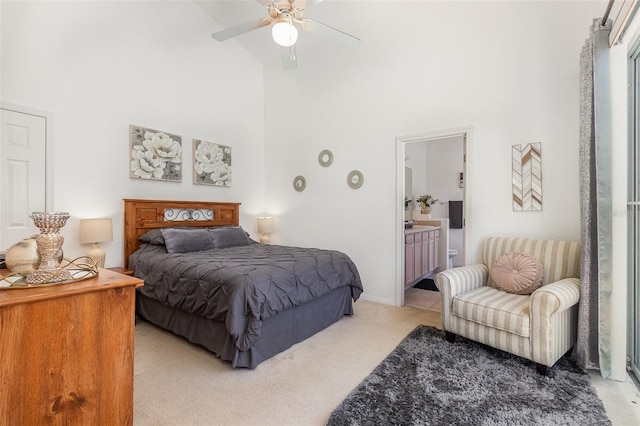 908 Andalusia Loop, Davenport, FL 33837 - bedroom featuring a towering ceiling, light colored carpet, connected bathroom, and ceiling fan
