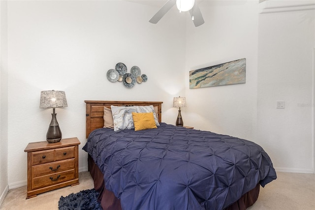 908 Andalusia Loop, Davenport, FL 33837 - bedroom with light colored carpet, baseboards, and ceiling fan