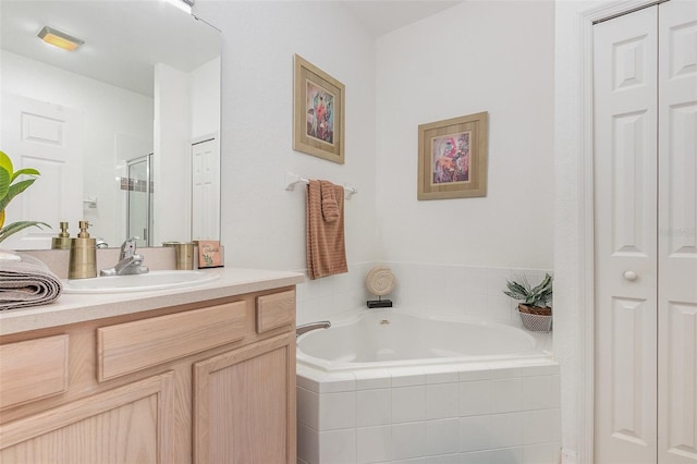 908 Andalusia Loop, Davenport, FL 33837 - full bath with a closet, vanity, a bath, and a shower stall