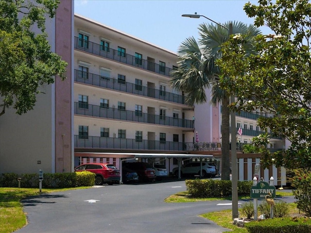 8174 Terrace Garden Dr N Unit 204, Saint Petersburg, FL 33709 - view of apartment building / complex featuring covered parking