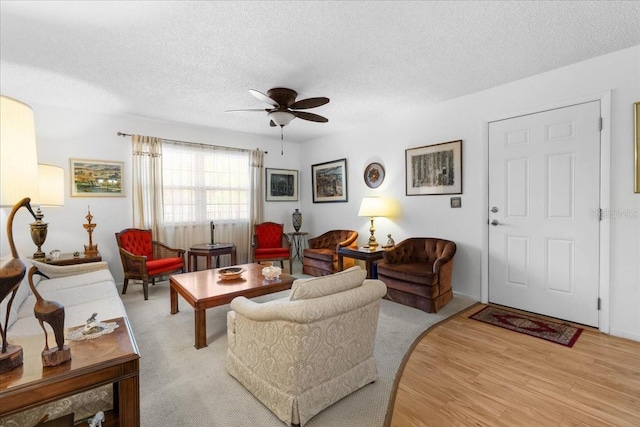 8174 Terrace Garden Dr N Unit 204, Saint Petersburg, FL 33709 - living area featuring ceiling fan, a textured ceiling, and light wood-style flooring