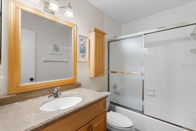 8174 Terrace Garden Dr N Unit 204, Saint Petersburg, FL 33709 - bathroom with vanity, toilet, shower / bath combination with glass door, and a textured ceiling