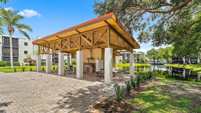 8174 Terrace Garden Dr N Unit 204, Saint Petersburg, FL 33709 - view of patio featuring a gazebo and a water view