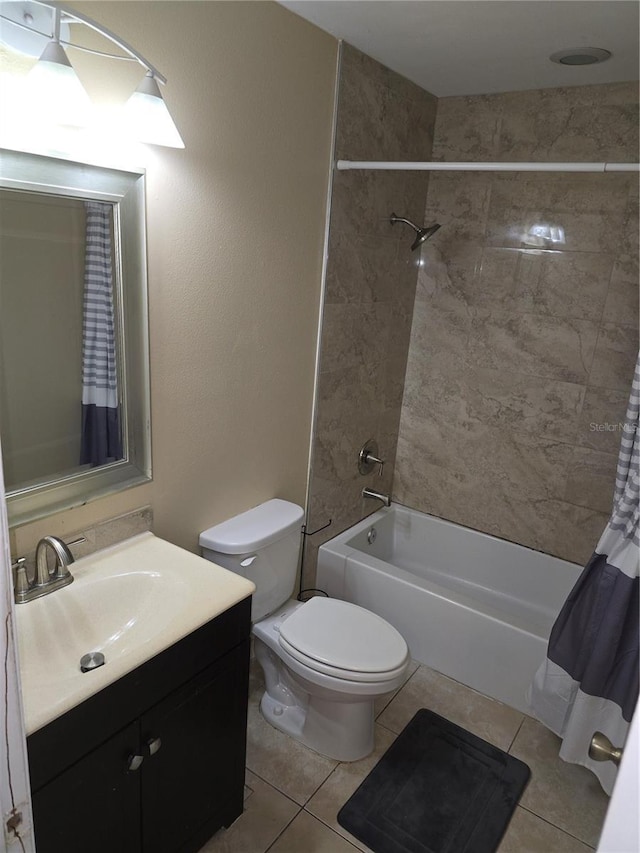 7168 E Bank Dr Unit 7168, Tampa, FL 33617 - bathroom with tile patterned floors, vanity, shower / bathtub combination with curtain, and toilet