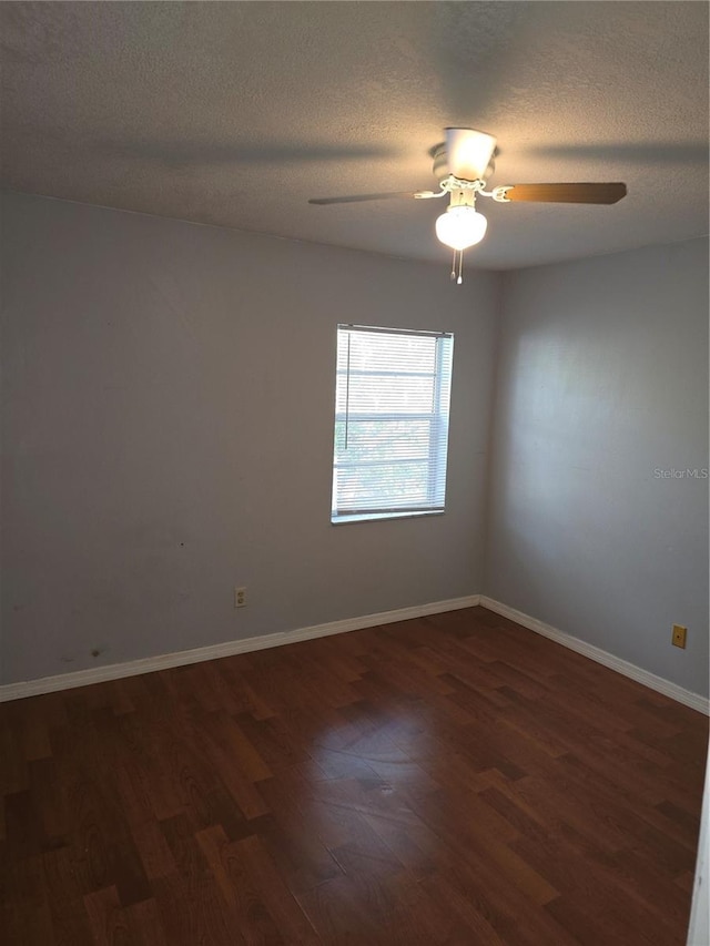 7168 E Bank Dr Unit 7168, Tampa, FL 33617 - empty room featuring dark wood finished floors, a textured ceiling, ceiling fan, and baseboards