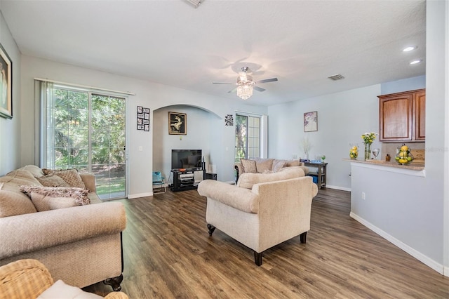 6736 Breezy Palm Dr, Riverview, FL 33578 - living room featuring arched walkways, baseboards, healthy amount of natural light, a ceiling fan, and recessed lighting