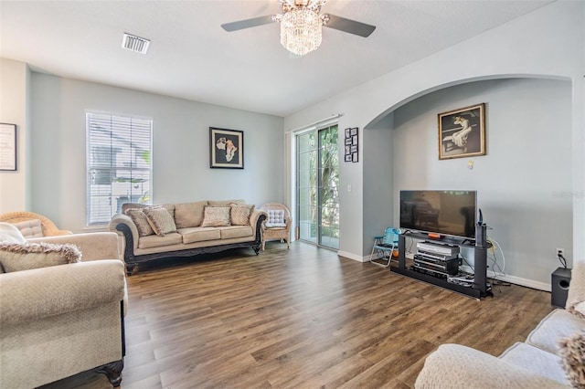 6736 Breezy Palm Dr, Riverview, FL 33578 - living area with arched walkways, ceiling fan, wood finished floors, and baseboards