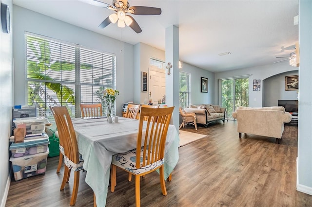 6736 Breezy Palm Dr, Riverview, FL 33578 - dining area with ceiling fan, wood finished floors, and arched walkways
