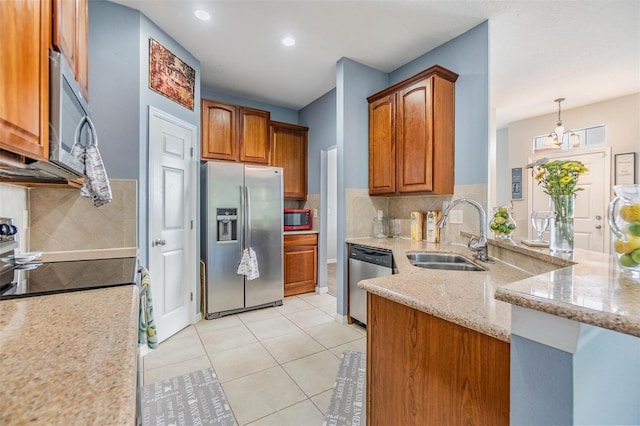 6736 Breezy Palm Dr, Riverview, FL 33578 - kitchen with stainless steel appliances, a sink, light stone countertops, brown cabinets, and recessed lighting